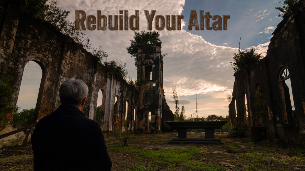 Man in broken church facing an altar in middle of building